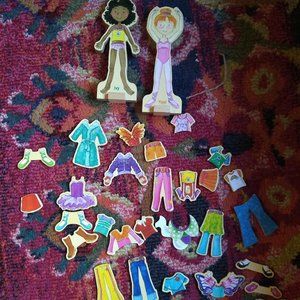 Two magnetic wooden dress up dolls